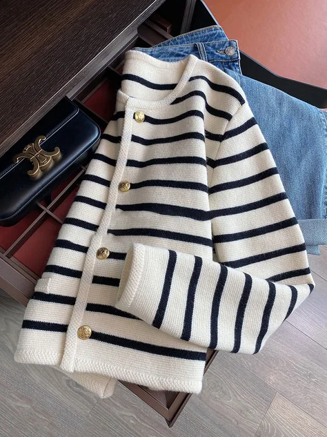 Carmina - a classic striped O-neck sweater that seamlessly blends comfort with sophistication